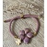 Bracelet coulissant Pampille mauve et doré + charm .