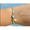 Bracelet à noeud coulissant avec charm .