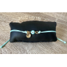 Bracelet à noeud coulissant avec charm .